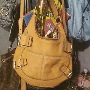 Michael Kors saddle tan leather handbag.